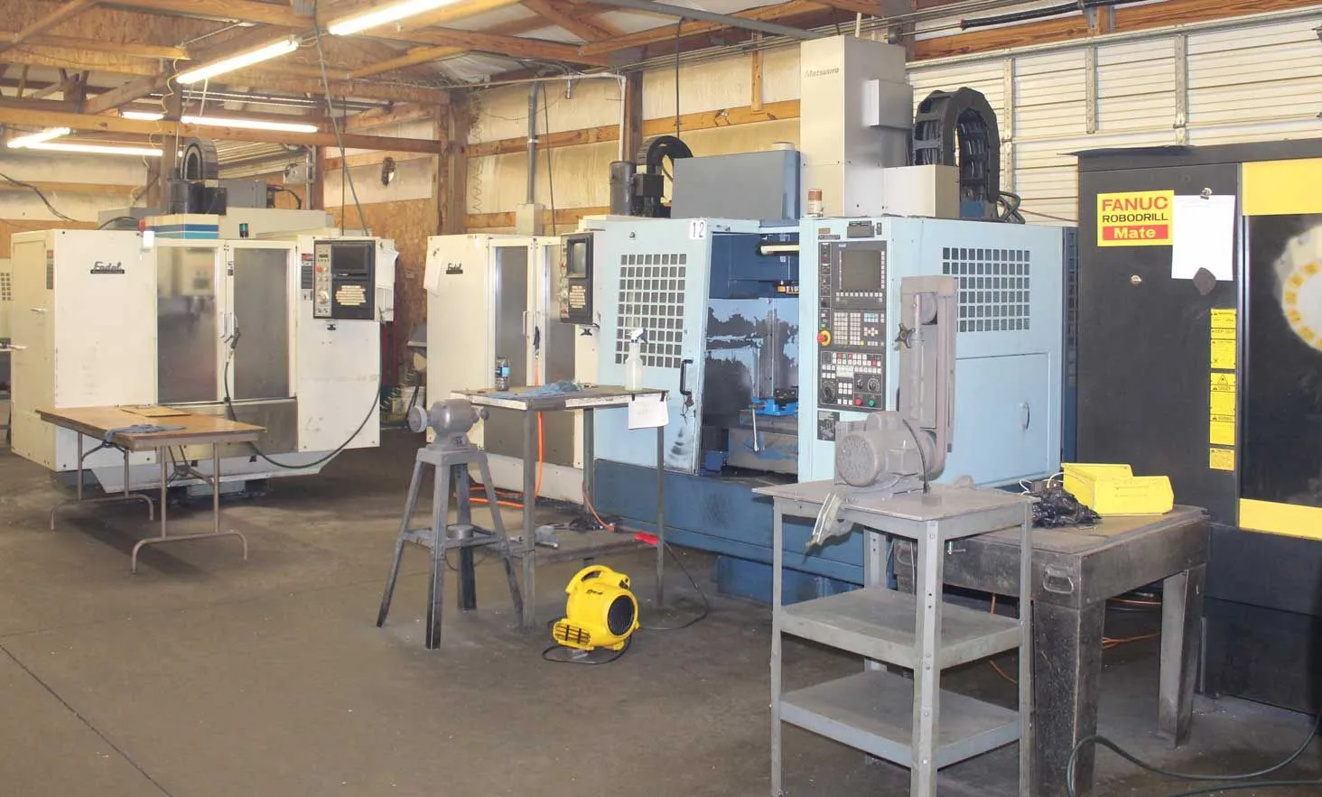 CNC mill at work on a metal part
