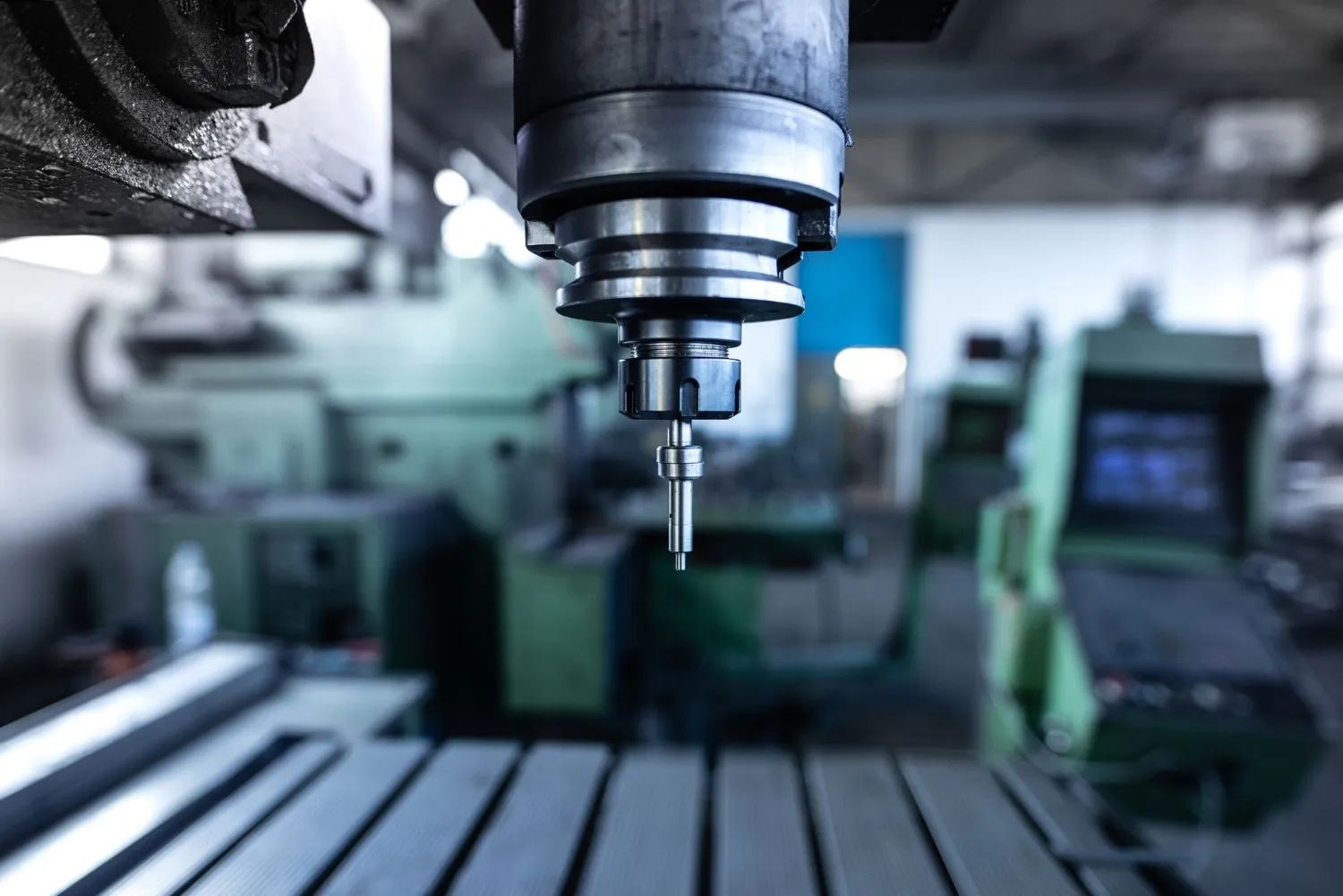 Industrial metal drill machine in a metalworking workshop